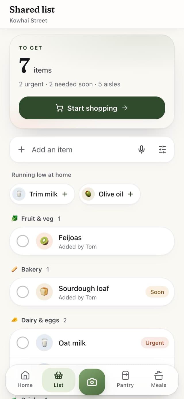 The shared shopping list, grouped by aisle, updating live for everyone